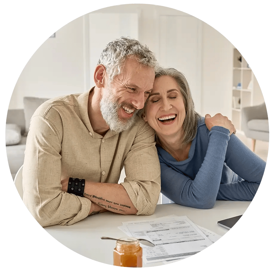 Two older people laughing 