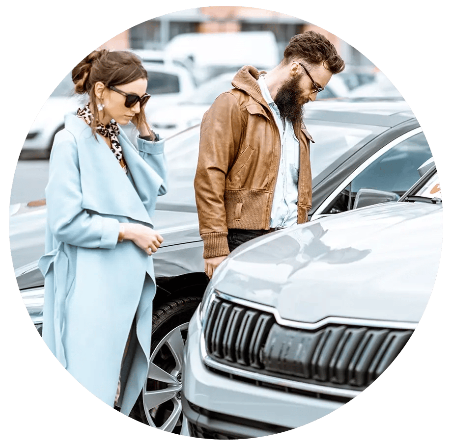 Couple looking at car