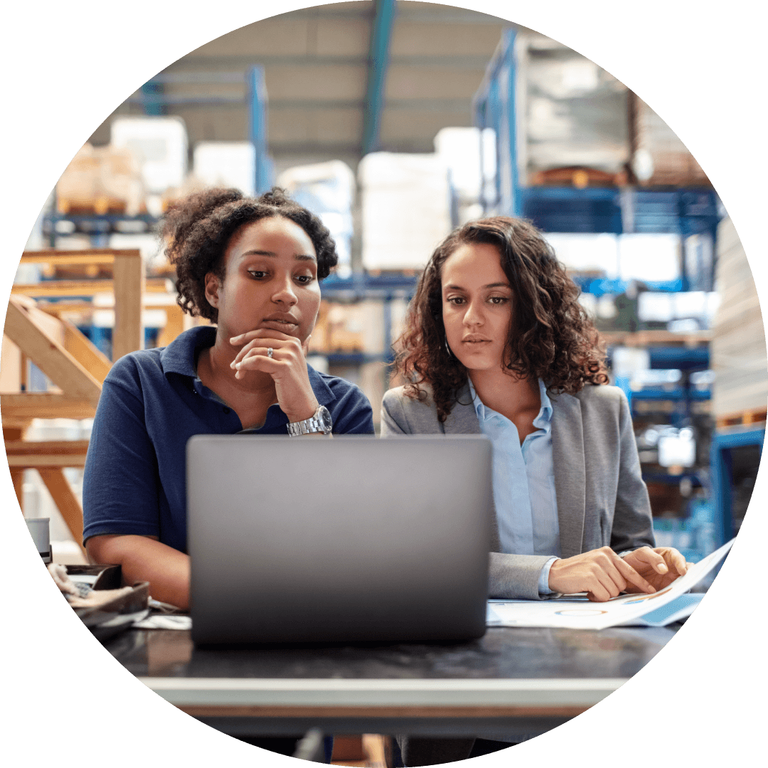 Two employees looking concerned at a laptop together